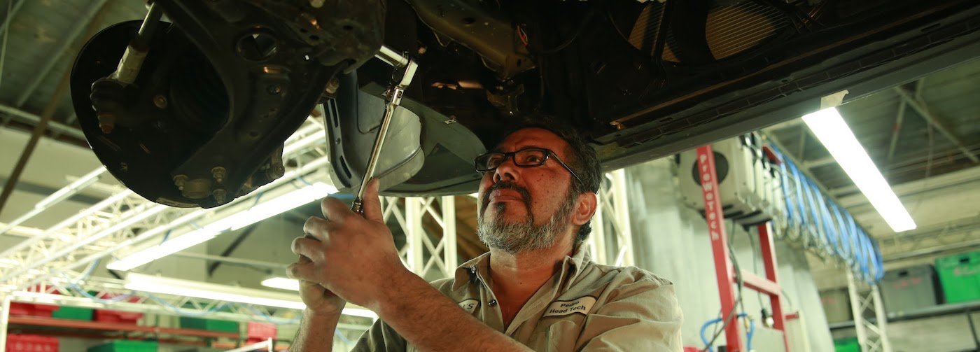 Man is working on a car